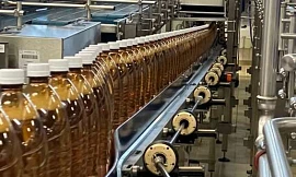 Rivella bottling line using Apiro gearbox system for changeovers