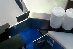 Spray bottles on a conveyor line being guided through the use of tribotape anti-friction tape